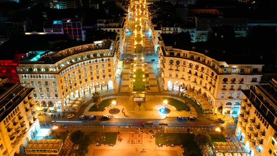 Photo of aerial drone night shot of iconic illuminated Aristotelous square in the heart of Thessalloniki or Salonica, North Greece.