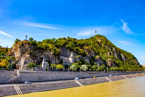 Photo of Liberty Statue and the Cave Church on the Gellert Hill in Budapest, Hungary.