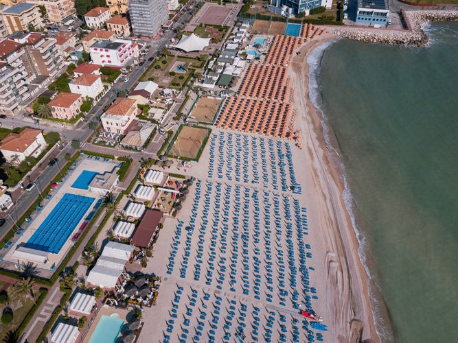 Italy,  aerial view of Fano with its sea, beaches, port, umbrellas