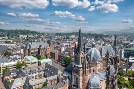 photo of view of Aachen (Germany) skyline panorama. Aerial view of Aachen Cathedral (Germany.: Aachener Dom) with Katschhof square and Town Hall (Rathaus) in background,Aachen 