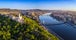 Photo of aerial panoramic skyline view of Budapest at sunrise. This view includes the Statue of Liberty, Elisabeth Bridge, Buda Castle Royal Palace and Szechenyi Chain Bridge with blue skyز