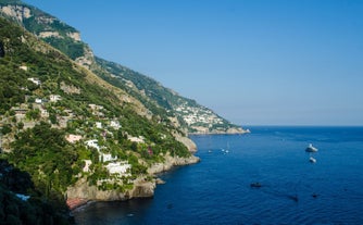 photo of Positano Amalfi Coast Italy Landscape Sunny and happiness view sea water blue and sky Italian village Ravello Nocelle Cinque terre pizza.