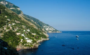 photo of Positano Amalfi Coast Italy Landscape Sunny and happiness view sea water blue and sky Italian village Ravello Nocelle Cinque terre pizza.