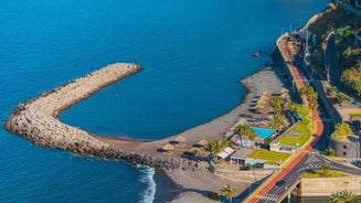 Aerial drone view of Camara de Lobos village, Madeira.