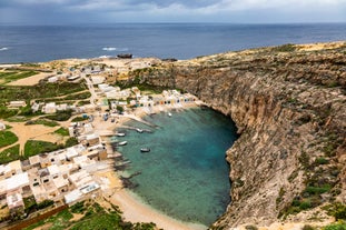 Photo of panoramic aerial view of St. Paul bay with acropolis of Lindos in background ,Rhodes, Greece.