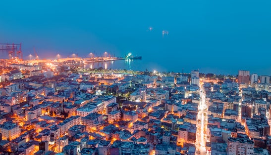 Photo of aerial view of Mersin city and port at at twilight blue hour, Turkey.