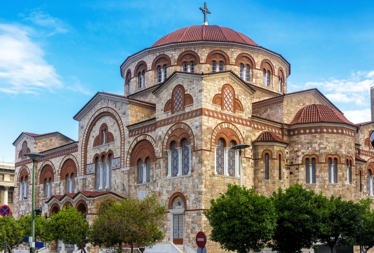 Photo of Church of Ieros Naos Agia Triada in Piraeus, Athens, Greece. It is tourist attraction of Piraeus. Monument of Greek Orthodox religion in Byzantine style. Concept of landmark and travel in Greece.