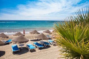 photo of aerial view of the beach and lagoon of Los Cristianos resort on Tenerife, Canary Islands, Spain.