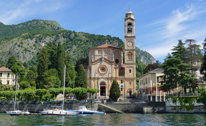 View of the city Mezzegra, Via Statale, Tremezzo CO, Alps, Italy. Colorful evening on the Como lake.