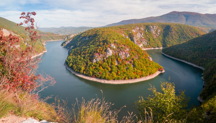 PHOTO OF VIEW OF An accumulation lake on the Vrbas River west of Banja Luka, in a canyon between the Manjača and Čemernica mountains. Beautiful view of nature with autumn colors. - Image