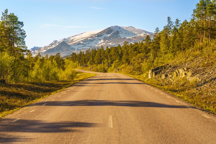 Road to Stora sjöfallet nationalpark in spring time with mountains in background with snow on top, Stora sjöfallet nationalpark, Gällivare county, Swedish Lapland, Sweden