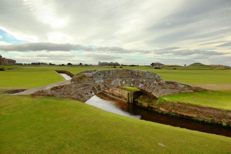 Photo of The famous Swilcan bridge on St Andrew Old Course .