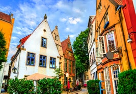 Photo of beautiful panoramic view of historic Bremen Market Square in the center of the Hanseatic City of Bremen with The Schuetting and famous Raths buildings on a sunny day with blue sky in summer, Germany.