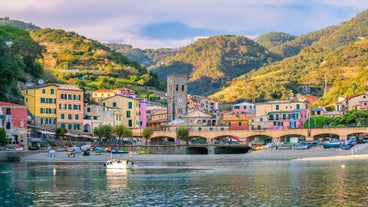 Photo of Riomaggiore with colorful houses along the coastline, one of the five famous coastal village in the Cinque Terre National Park, Liguria, Italy.