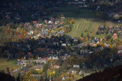 A view of Zakopane city from the summit of Sarnia Skała, situated at an altitude of about 1,377 meters. Sarnia Skała, Tatra National Park, Zakopane, Poland. October 09, 2022.