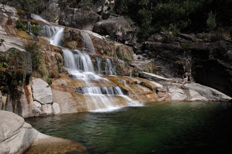 Photo of the Cascata Fecha de Barjas waterfalls in the Peneda-Geres National Park in Portugal.