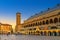 PHOTO OF Palazzo della Ragione medieval town hall and palace of justice building, Torre degli Anziani tower in Piazza dei Frutti square in Padua historical centre, twilight evening view, Veneto Region, Italy