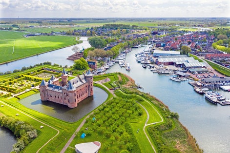 photo of aerial from the medieval Muiderslot castle and the city Muiden in the Netherlands.