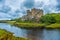 Photo of Dunvegan Castle on the Isle of Skye, Highlands of of Scotland. Seat of the MacLeod Clan. Built on an elevated rock overlooking an inlet on the eastern shore of the sea Loch of Dunvegan.