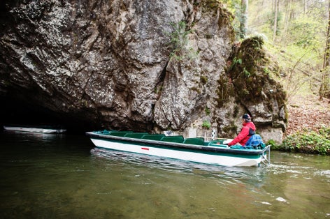 Photo of boat in cave lake of Punkva Caves, Czech Republic.