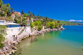 photo of aerial panoramic view of beautiful town of Lovran and sea walkway in Croatia.