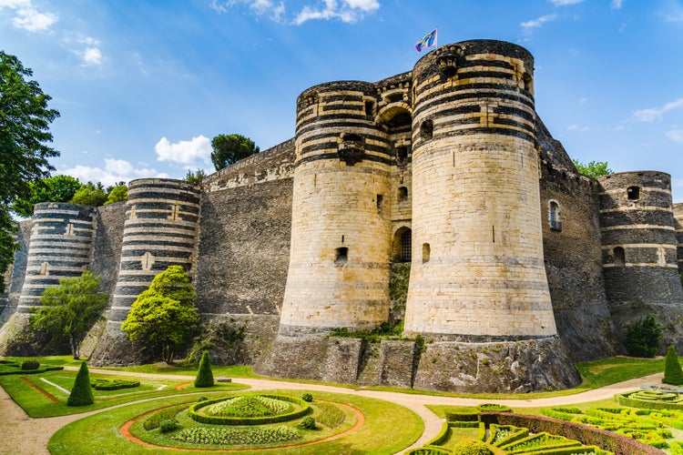 Photo of Angers, France: Castle of Angers, founded in 9th century by the Counts of Anjou, expanded to its current size in 13th century, a historical monument since 1875, located overhanging the river Maine.