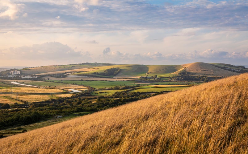 photo of view of Evening golden hour from mount Caburn over the Lewes downs east Sussex south east England UK.