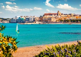 Photo of aerial view of Otranto town in Puglia with crystal turquoise waters, Italy.