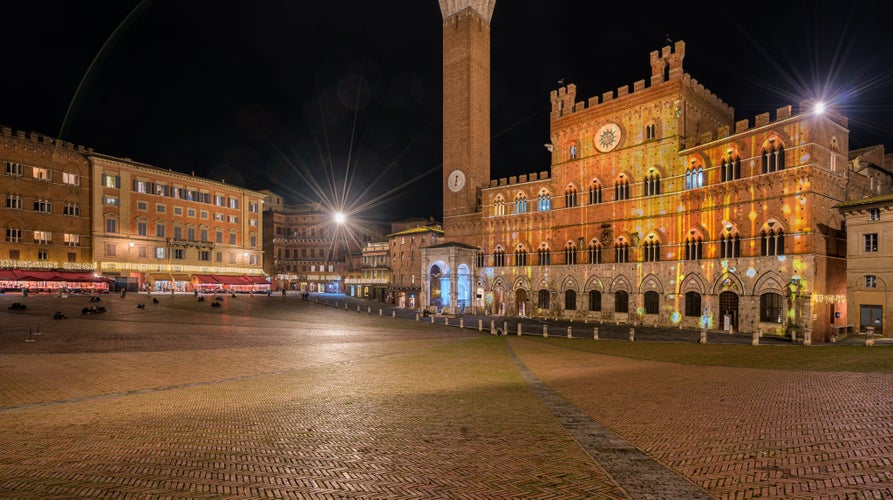 photo of view of Arezzo, Tuscany, Italy: night view of the main square Piazza Grande, Arezzo, Italy.