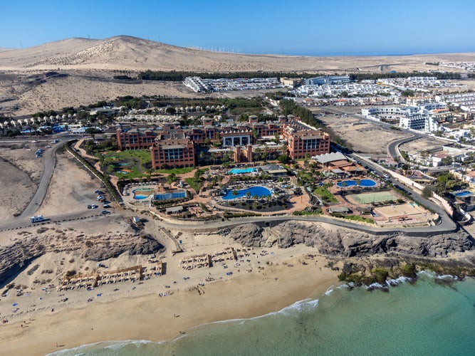 Photo of aerial view on sandy dunes, beach and Costa Calma, Fuerteventura, Canary islands, Spain.