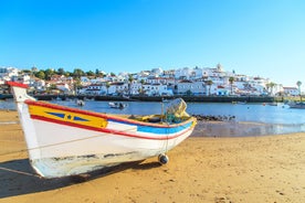 Photo of Carvoeiro fishing village with beautiful beach and colourful houses, Portugal.