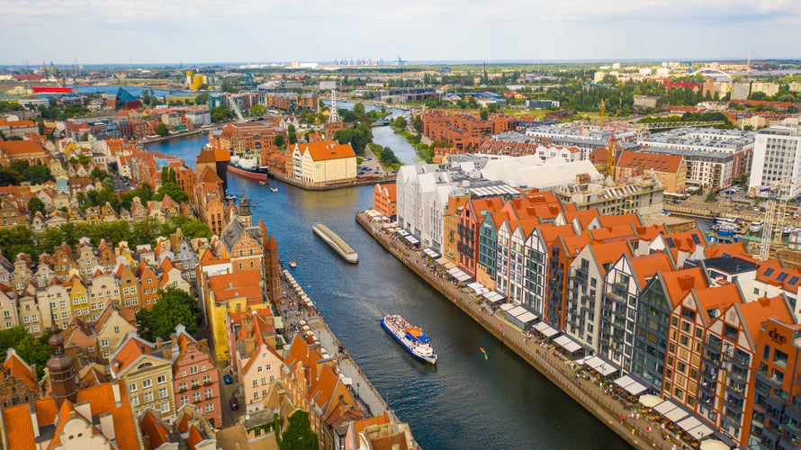 Photo of beautiful panoramic aerial view to old city Gdansk, Motlawa river, Poland.