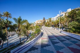 photo of Almuñécar, Spain - A scenic view of a coastal city with white buildings and a blue ocean in the background.