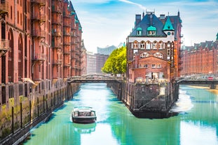 Photo of beautiful panoramic view of historic Bremen Market Square in the center of the Hanseatic City of Bremen with The Schuetting and famous Raths buildings on a sunny day with blue sky in summer, Germany.