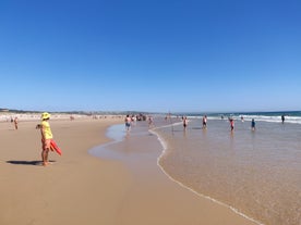 Photo of aerial view of Costa da Caparica coastline of glorious sandy beaches, powerful Atlantic waves, Portugal.