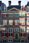 Amsterdam Netherlands dancing houses over river Amstel landmark in old european city spring landscape.