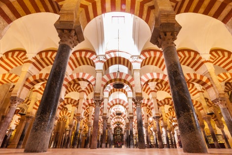 photo of interior of The Mezquita Catedral and former Great Mosque of Cordoba, Spain.