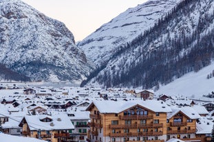 Photo of aerial view of Livigno town covered in snow in winter, Italy.