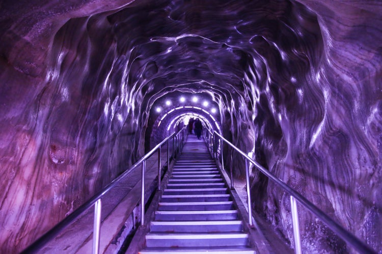 photo of view of Illuminated underground entrance of Turda salt mine, Cluj, Romania