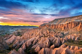 Hot air balloons flying over Uchisar Castle. Cappadocia. Nevsehir Province. Turkey.