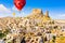 Hot air balloons flying over Uchisar Castle. Cappadocia. Nevsehir Province. Turkey.