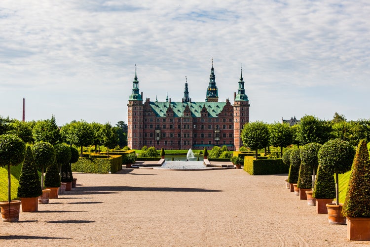 photo of view of The majestic castle Frederiksborg Castle seen from the beautiful park area, Region of Southern Denmark, Denmark.