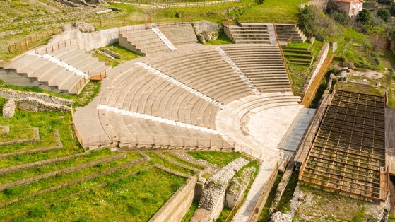 Aerial view of the ancient remains of a Roman theater. The archaeological site is located in Tivoli, near Rome, Italy.
