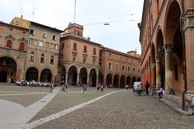 Photo of Italy Piazza Maggiore in Bologna old town tower of town hall with big clock and blue sky on background, antique buildings terracotta galleries.