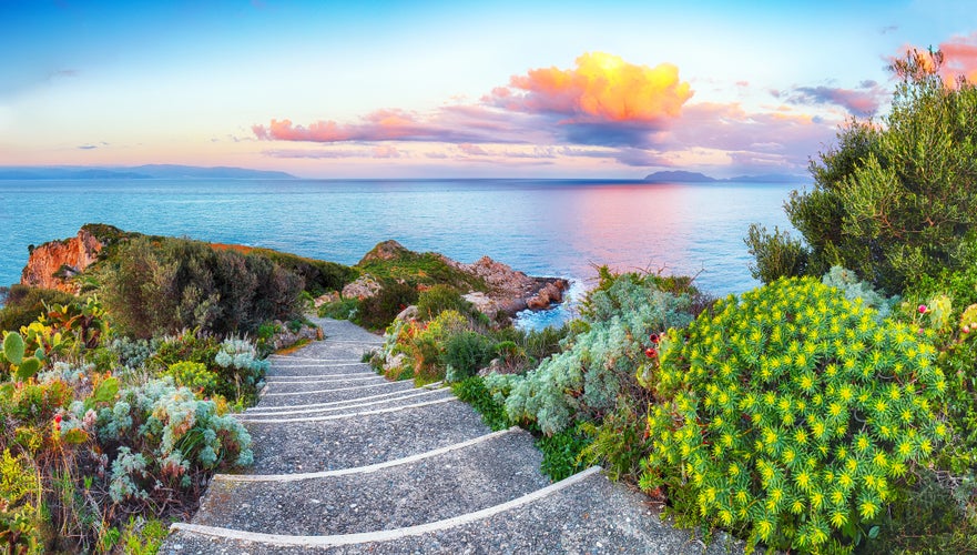 Photo of dramatic spring sunset on the the cape Milazzo, Italy.