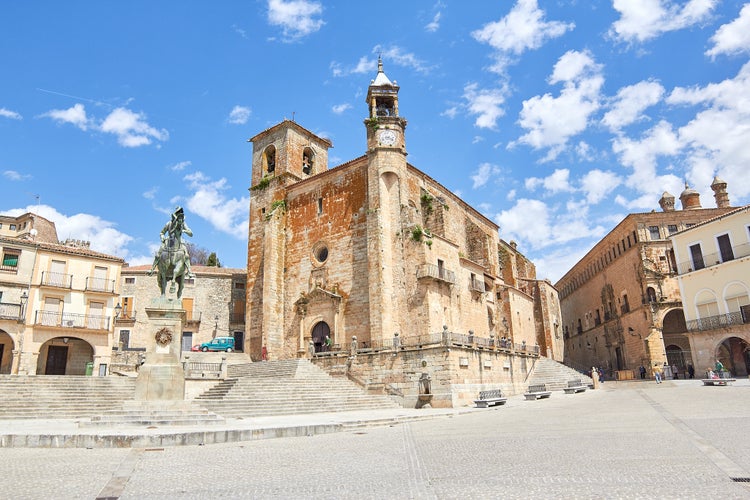 photo of Large medieval church of pieces rising majestically in the main square of Trujillo, Spain.