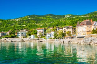 photo of aerial panoramic view of beautiful town of Lovran and sea walkway in Croatia.