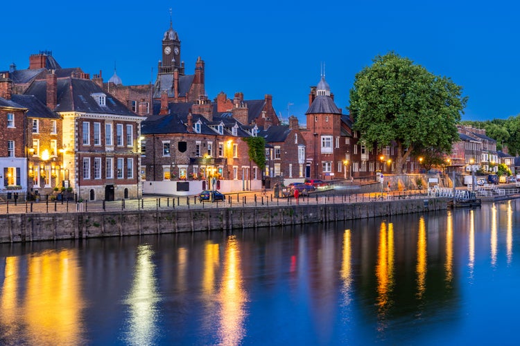 Photo of York cityscape along river ouse sunset dusk, York Yorkshire England UK.