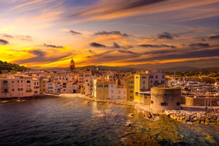 Photo of beautiful aerial view of Saint-Tropez, France with seascape and blue sky.