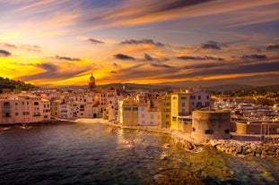 Photo of beautiful aerial view of Saint-Tropez, France with seascape and blue sky.